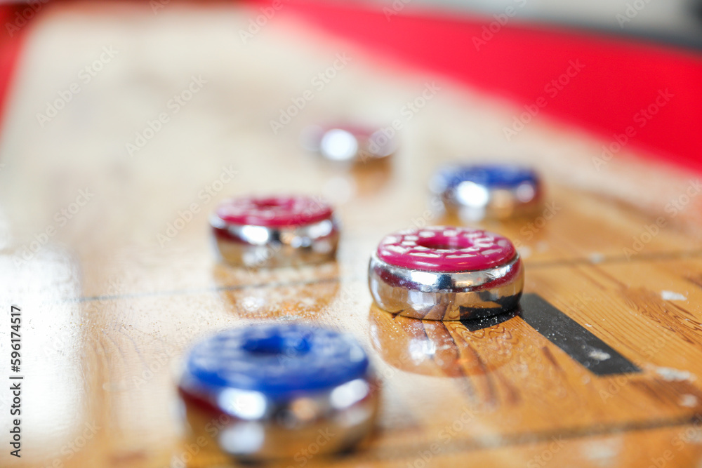 Shuffleboard is a game of precision and strategy, where players slide