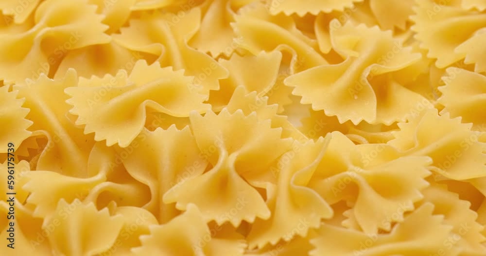 pasta backgroud - macro view of Dry Authentic Italian farfalle pasta backgroud - macro view of Dry Authentic Italian farfalle