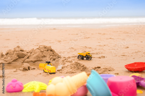Colorful toys on the beach by the sea