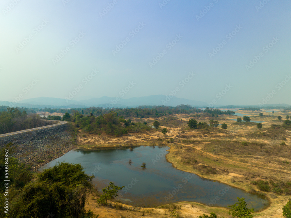 View of the river in the countryside. Drone aerial photograph of Chong Khao Khat Dam Viewpoint in Uttaradit in Thailand.
