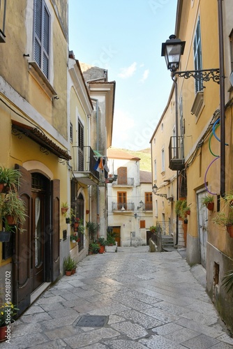 Fototapeta Naklejka Na Ścianę i Meble -  A narrow street among the old houses of Sant'Agata de' Goti, a small town of Benevento province, Italy.