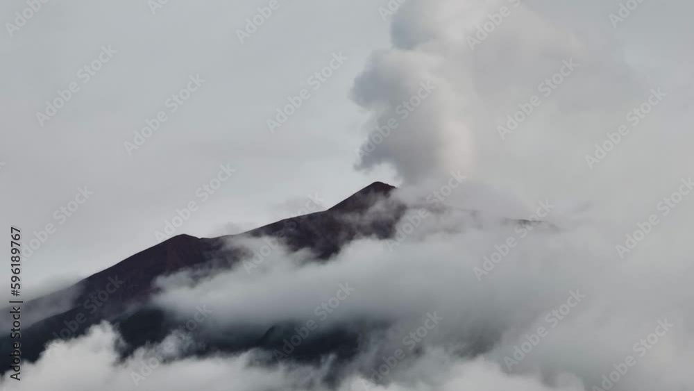 Mount Kerinci with clouds the highest active volcano in West Sumatra, Indonesia. Mount Kerinci with clouds the highest active volcano in West Sumatra, Indonesia.