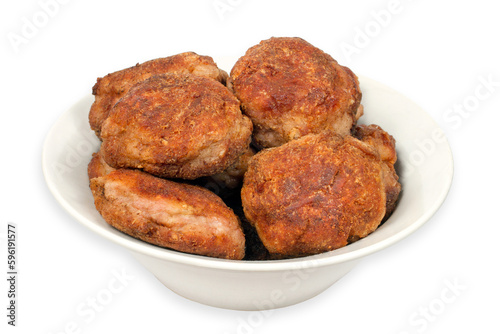 Meat cutlets in a plate on a white background. Homemade meatballs. Lots of meatballs on the plate.