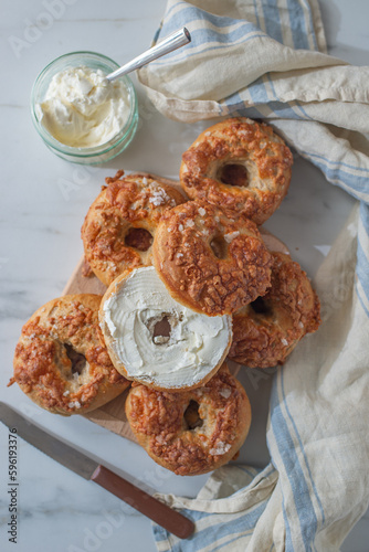 home made whole grain Bagels with cheese on a table