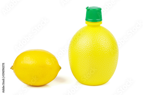 Lemon juice(condiments) in a bottle and lemon isolated on a white background photo