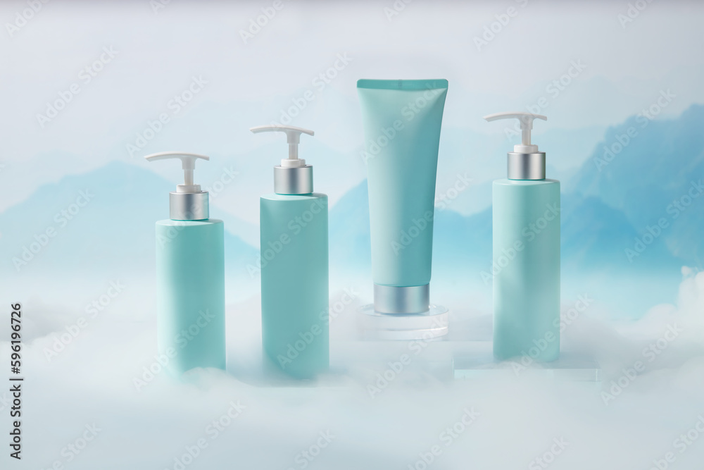 Set of cosmetic container with pump dispenser bottles and tube in light blue color placed on transparent podium. Natural background with mountains behind and white smoke Set of cosmetic container with pump dispenser bottles and tube in light blue color placed on transparent podium. Natural background with mountains behind and white smoke