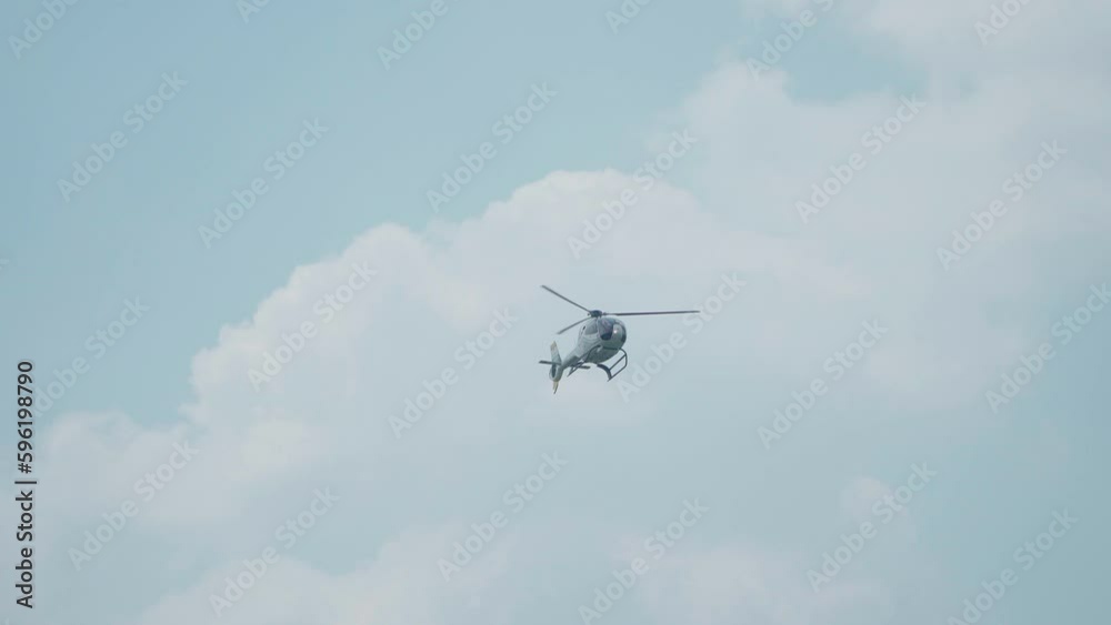 Jakarta, Indonesia - April 9, 2023: Indonesian Air Force (TNI AU) EC120B Colibri helicopter performs at the Indonesian Air Force's birthday event at Halim Perdana Kusuma Jakarta, Indonesia - April 9, 2023: Indonesian Air Force (TNI AU) EC120B Colibri helicopter performs at the Indonesian Air Force's birthday event at Halim Perdana Kusuma