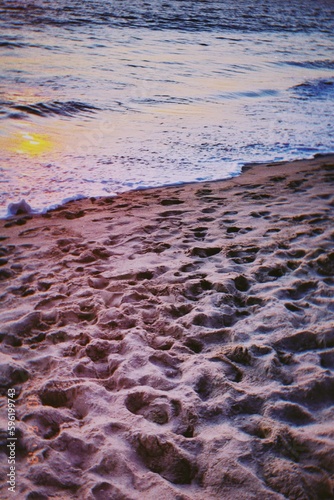 waves on the beach at sunset