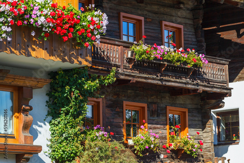 Flowering balconies on houses in the alps
