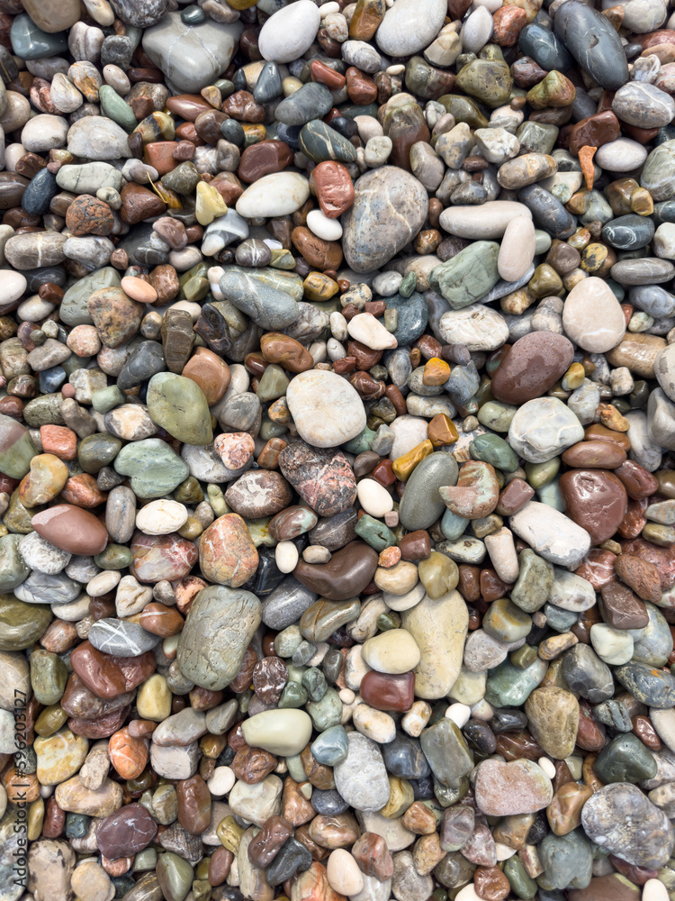 colorful pebbles on the beach colorful pebbles on the beach