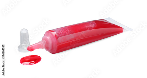 Tube with red food coloring isolated on white