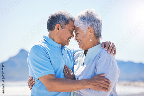 Senior couple, hug and beach love outdoor with support and romance in nature. Ocean, elderly and old woman and man together on summer holiday by the sea feeling happiness and relax on vacation