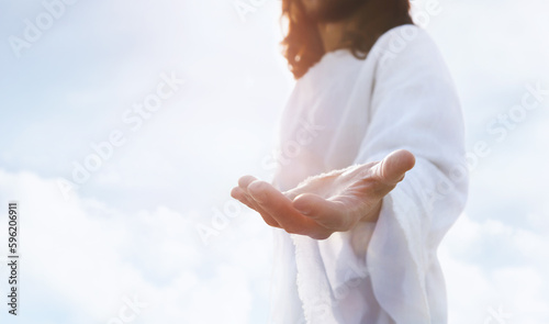 Fotografia Heaven and cross love and faith and salvation concept of Jesus Christ reaching o