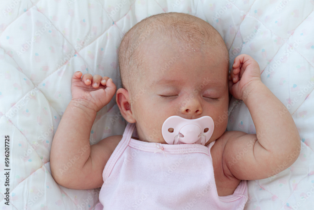 A newborn baby sleep calming thanks to dummy A newborn baby sleep calming thanks to dummy