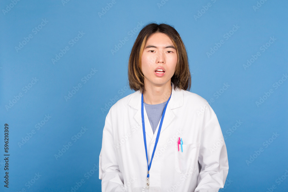 Stunned Asian Scientist in White Lab Coat: Studio Shot Stunned Asian Scientist in White Lab Coat: Studio Shot