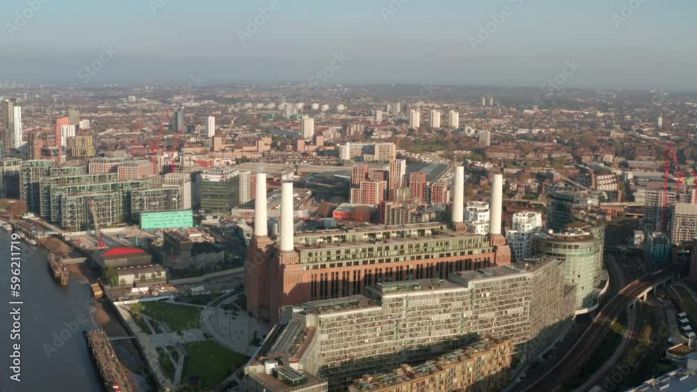 Establishing circling aerial shot around Battersea Power station redeveloped Establishing circling aerial shot around Battersea Power station redeveloped