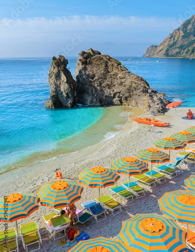 Obraz na plátně Monterosso beach vacation Chairs and umbrellas on the beach of Cinque Terre Italy