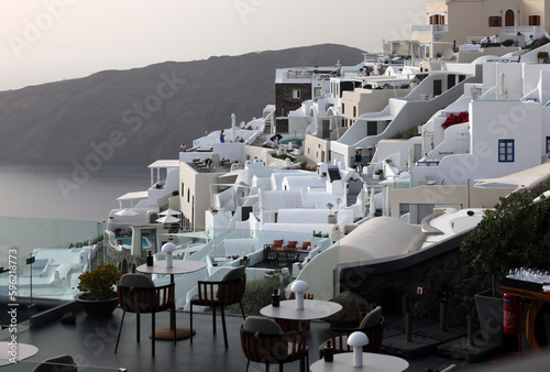 Whitewashed houses with terraces and pools and a beautiful view in Imerovigli on Santorini island, Greece © wjarek