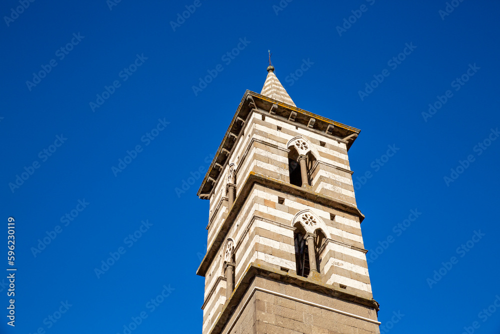 Italy, Lazio, Viterbo, Bell tower of Chiesa di San Giovanni Battista degli Almadiani standing against clear blue sky Italy, Lazio, Viterbo, Bell tower of Chiesa di San Giovanni Battista degli Almadiani standing against clear blue sky