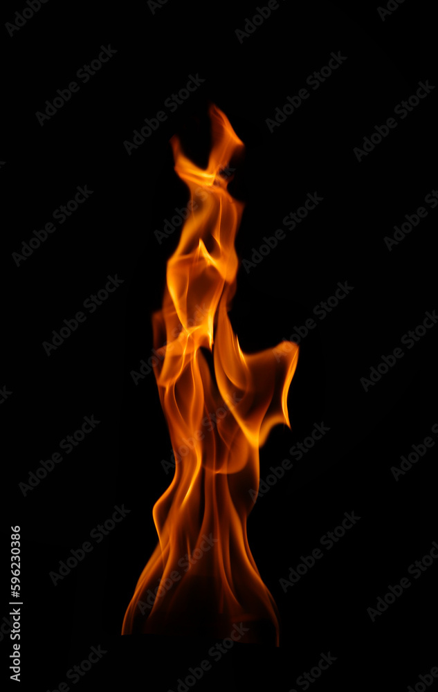 Burning flame isolated on dark background Burning flame isolated on dark background