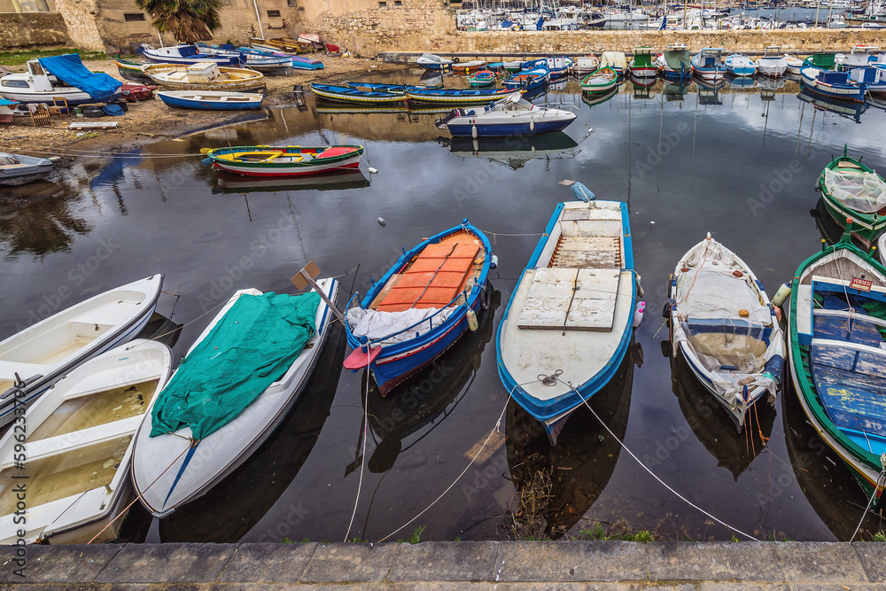 Fishing boats in port of Syracuse town, Sicily, Italy