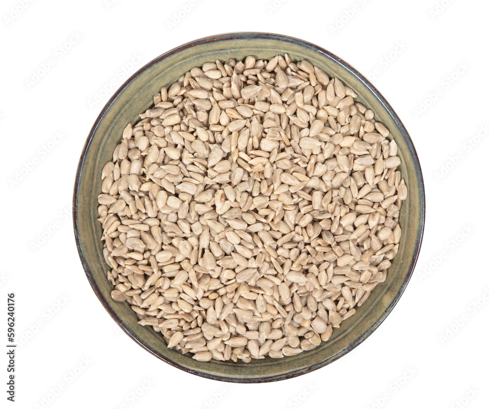 Heap of natural shelled sunflower seeds over white background Heap of natural shelled sunflower seeds over white background
