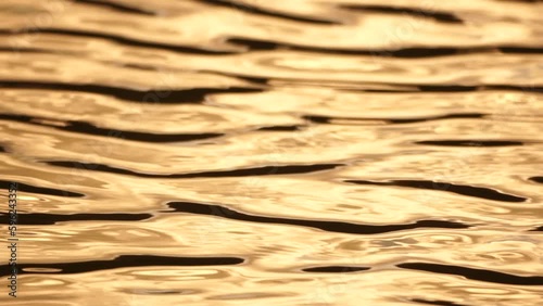 Wallpaper Mural Sun reflecting on sparkling sea lake water surface, ocean at sunset, sunrise. Sunrays flickering in Ripples on water surface. Golden shimmering sea waves in sun. Slow motion. Abstract nautical nature Torontodigital.ca