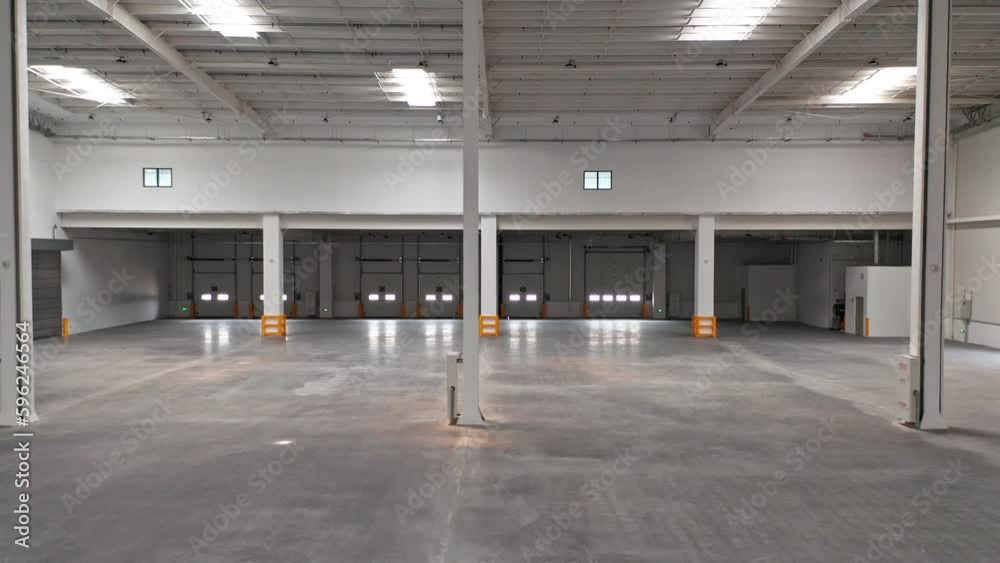 Aerial Shot of Interior of Newly Built Empty Distribution Warehouse Aerial Shot of Interior of Newly Built Empty Distribution Warehouse