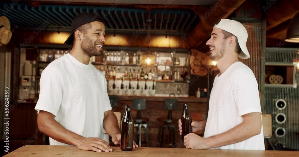 Group of friends drinking beer, chatting and having good time at pub. Male colleagues in good mood drinking draft beer and relaxing. A multiracial Friends enjoying the weekend night together in a bar Group of friends drinking beer, chatting and having good time at pub. Male colleagues in good mood drinking draft beer and relaxing. A multiracial Friends enjoying the weekend night together in a bar