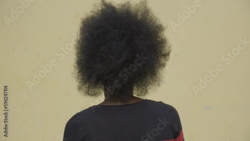 Afro hair of African woman with back to camera