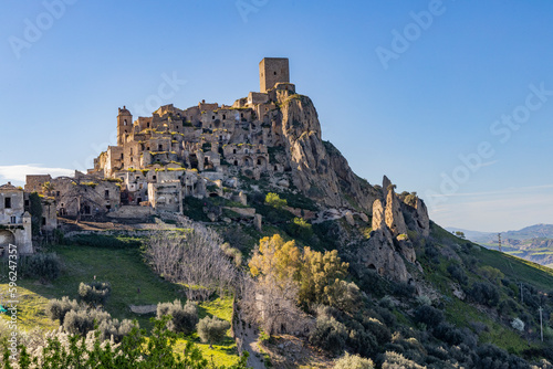 Craco, Basilicata. Abandoned city. A ghost town built on a hill and abandoned due to geological problems. Surreal look, horror film scenery. Panorama of the Calanchi Park.
