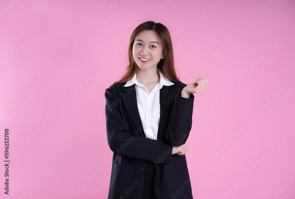 image of businesswoman posing on pink background image of businesswoman posing on pink background