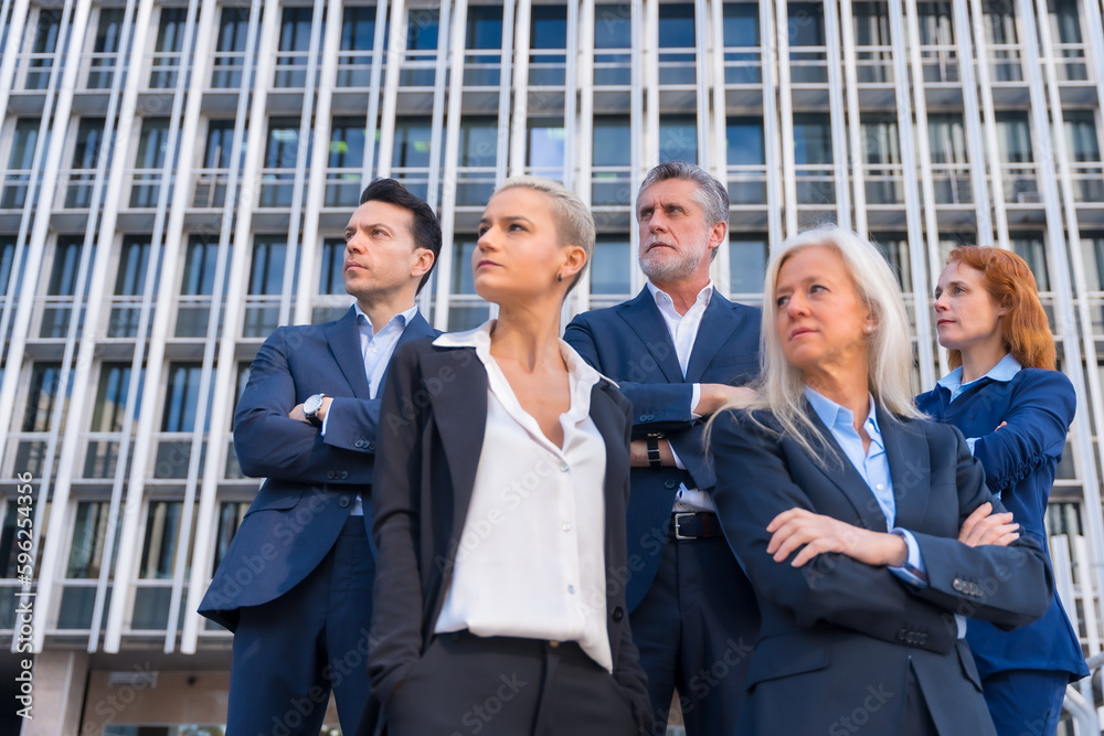 Senior Executives Strike a Confident Pose in Commercial Building Setting Senior Executives Strike a Confident Pose in Commercial Building Setting