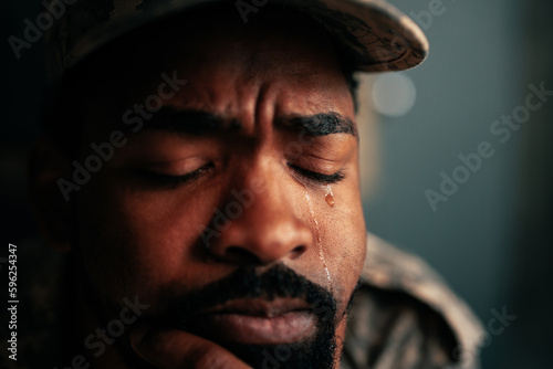 American soldier crying in office.