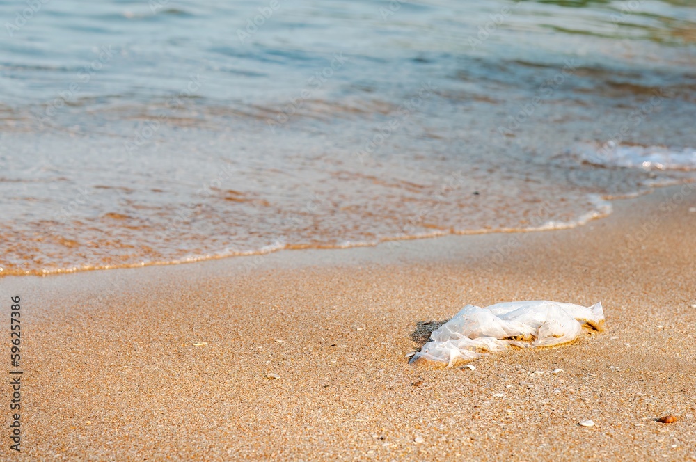 The plastic bag on the sea beach on the sea in Thailand. The plastic bag on the sea beach on the sea in Thailand.