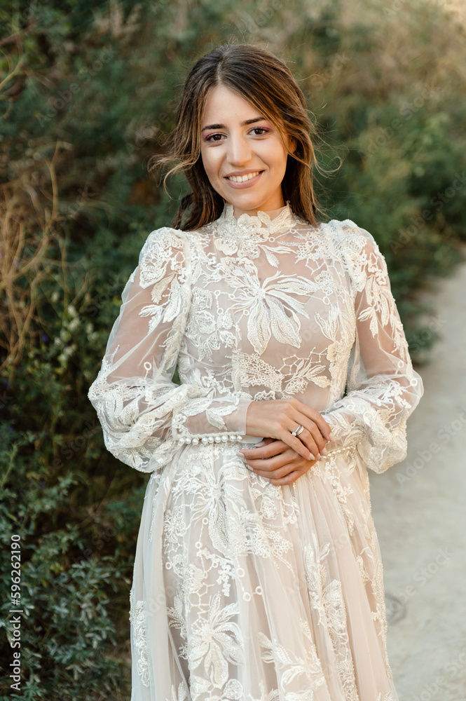 portrait of a contented young bride outdoors in the summer. medium plan. bride on a walk portrait of a contented young bride outdoors in the summer. medium plan. bride on a walk