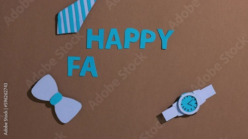 Stop motion animation with text happy father's day on brown background. Celebration, gift for dad day concept. Promotional video card. Top view, flatlay. (ID: 596262743)