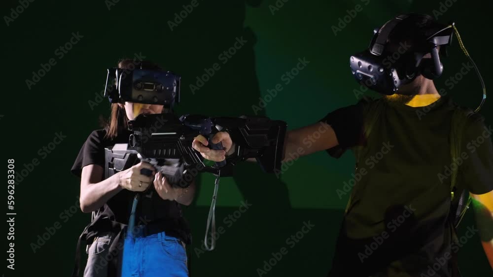 Video Stock An active emotional man and woman in a VR headset with