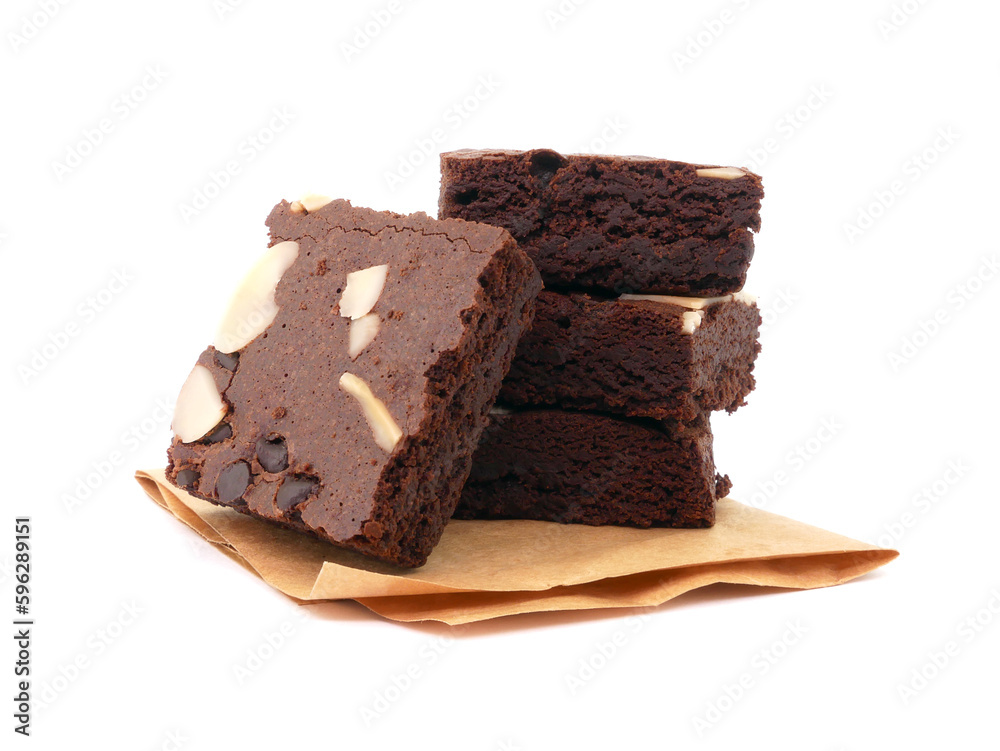 Brownies on paper isolated white background. Chocolate brownie with sliced almond nuts toppings. Chocolate Brownie pieces. selective focus.