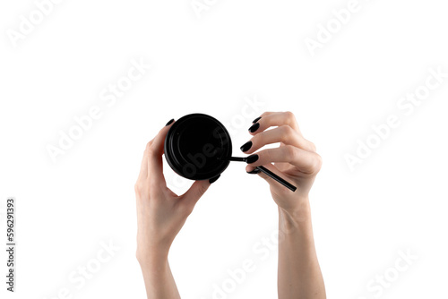 Woman holding paper cup of hot coffee with white background. Female hand with black nails.