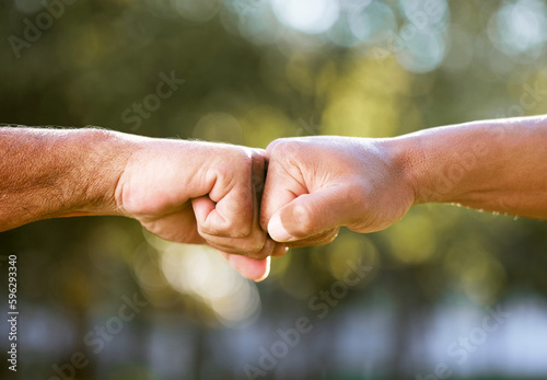 Lets get it. Shot of two unrecognisable men bumping fists outdoors. © Jade M/peopleimages.com