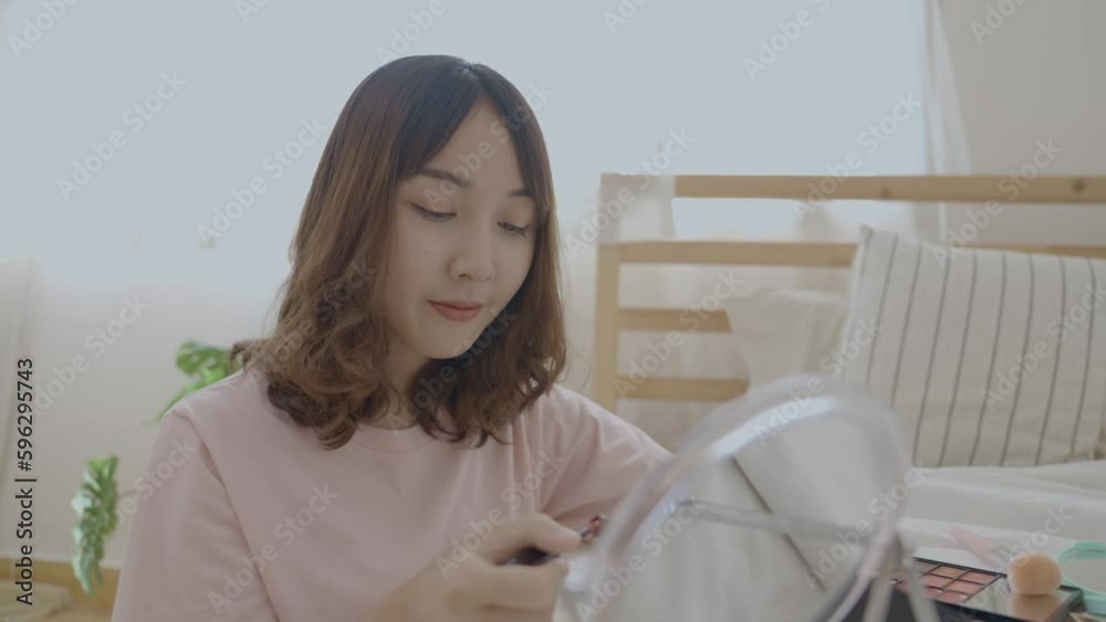 Beauty concept of 4k Resolution. Asian girls make makeup on the bed in the bedroom. Beauty concept of 4k Resolution. Asian girls make makeup on the bed in the bedroom.