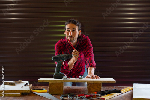 Handsome man working in garage