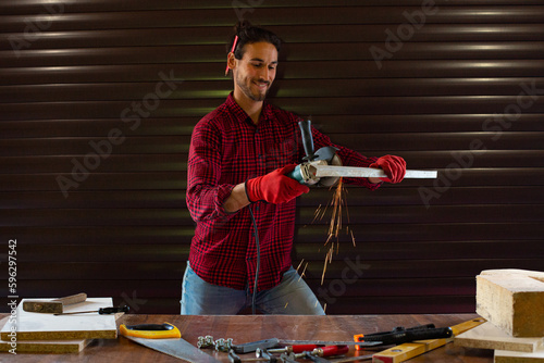 Handsome man working in garage
