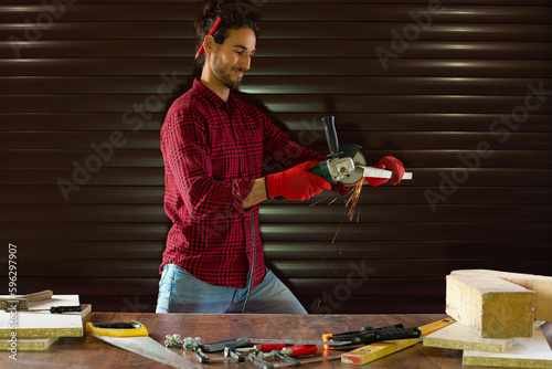 Handsome man working in garage