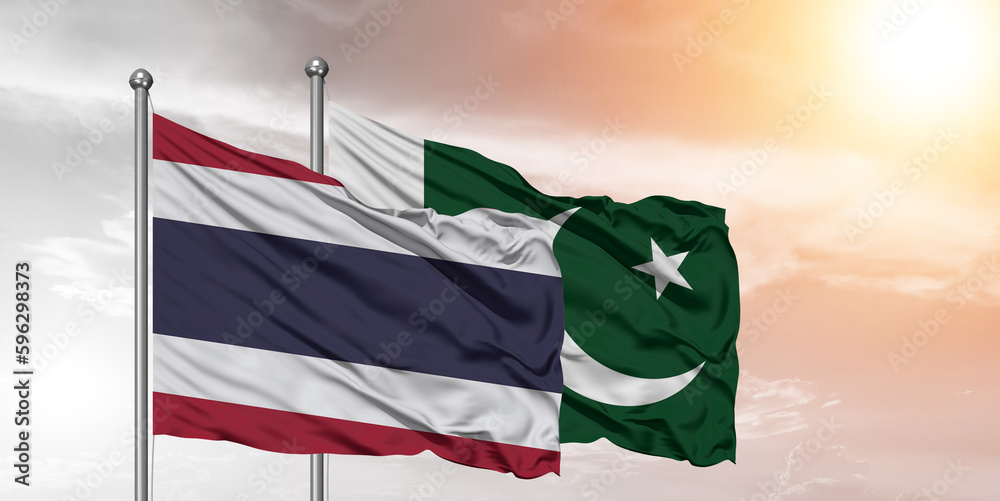 Flags of Pakistan and Thailand friendship flag waving on the sky with beautiful sky. Flags of Pakistan and Thailand friendship flag waving on the sky with beautiful sky.