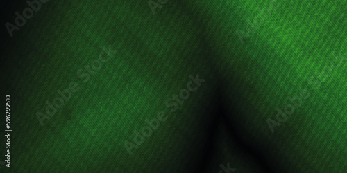Abstract background with blur green texture fabric . elegant dark emerald green background with black shadow border and fabric grunge texture design . 
