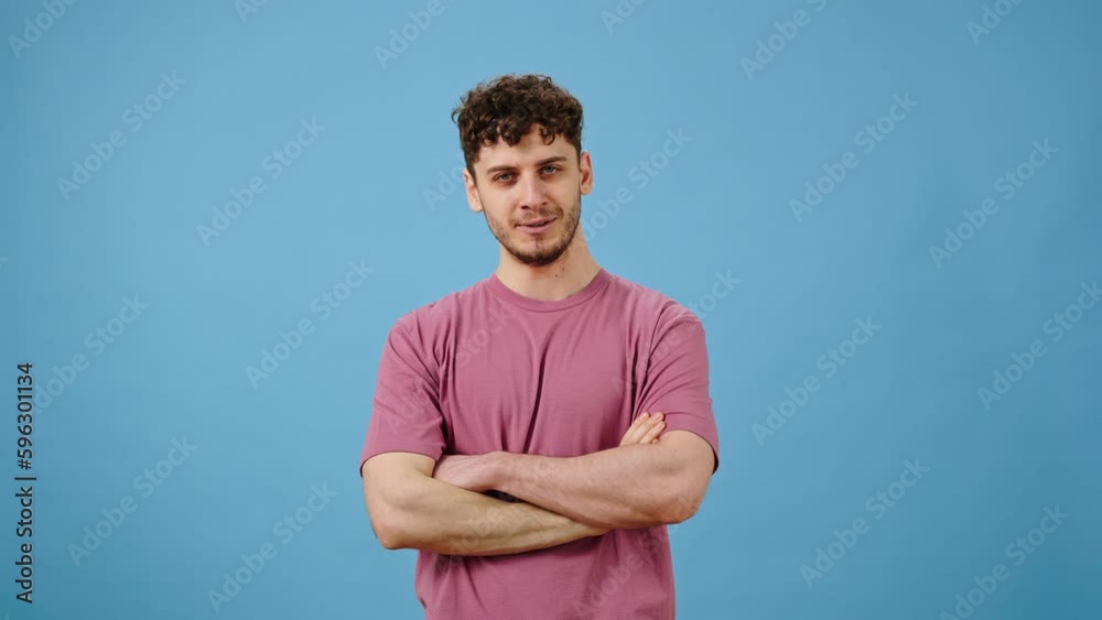 Young man showing tasty gesture, kisses fingers and says bellissimo, isolated on blue background Young man showing tasty gesture, kisses fingers and says bellissimo, isolated on blue background