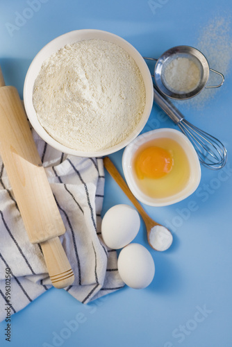 Ingredients for baking on blue background