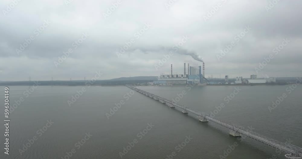 Drone fly above coal power plant based in konin poland replaced with nuclear energy station, warta river aerial view Drone fly above coal power plant based in konin poland replaced with nuclear energy station, warta river aerial view